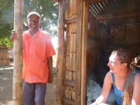 Kim meeting with a village elder in a rural village while doing research.