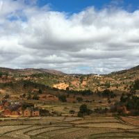 Small villages dot rice field landscapes as you drive south from Antananarivo through the rolling hills of Madagascar's Highlands. Photo by Lynne Venart.