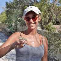 Ellie Dobbs in Madagascar with a chameleon